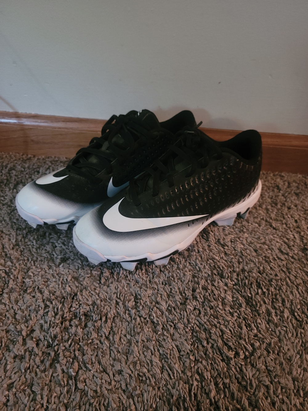 Nike Black and White Kids Cleats with Bold Swoosh